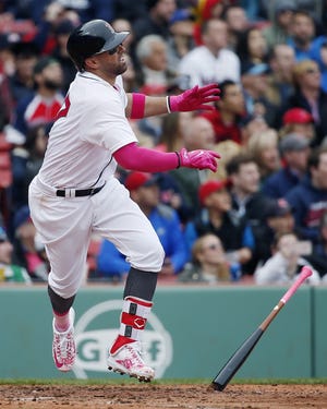 The Red Sox's Deven Marrero watches his two-run double during the fifth inning against the Tampa Bay Rays, Saturday in Boston. [Michael Dwyer/The Associated Press]