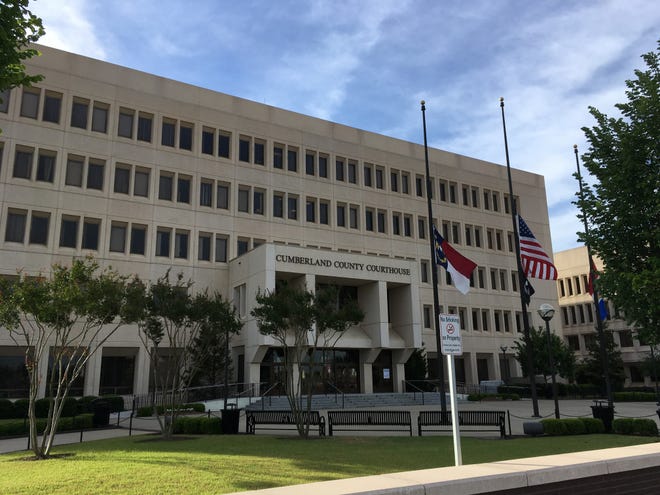 Retired and current legal and criminal justice officials want Cumberland County commissioners to name the courthouse for Judge Maurice Braswell. [Steve DeVane/The Fayetteville Observer]