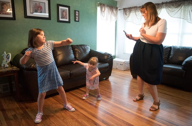 Two-year-old Frankie Dever (center) plays a game called freeze dance with her sister, Sophia, 6, and mother, Vincenza, at their Abington home Wednesday, May 10, 2017. Frankie has a heart rhythm abnormality called Prolonged QT Syndrome that causes seizures. The family is a member of Mended Little Hearts.