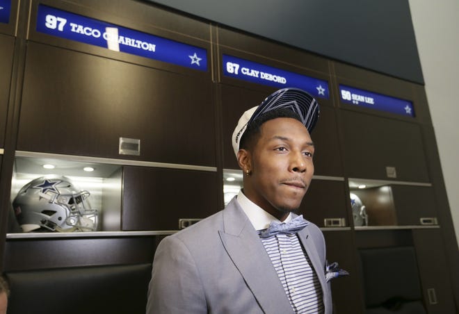 Dallas Cowboys No. 1 draft pick defensive end Taco Charlton stands next to his his new locker at the team's football headquarters in Frisco, Texas, on April 28. [AP Photo / LM Otero]