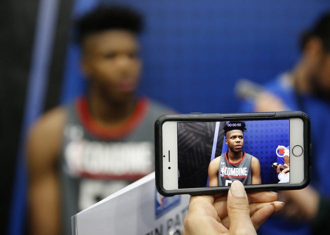 Justin Patton, from Creighton, displayed on a cellphone video, responds to a question at the NBA draft basketball combine Thursday in Chicago. [AP Photo / Charles Rex Arbogast]