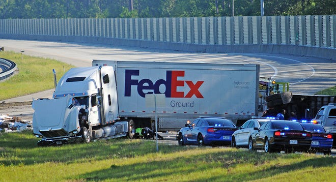 A FedEx truck crashed into a smaller vehicle Monday morning, causing the closure of northbound lanes of Interstate 95 north of Brunswick from the Golden Isles Parkway to Georgia 99. (Terry Dickson/Florida Times-Union)