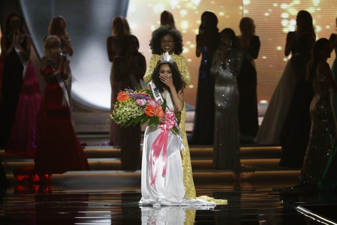 Miss District of Columbia USA Kara McCullough reacts as she is crowned the new Miss USA by former Miss USA Deshauna Barber during the Miss USA contest Sunday, May 14, 2017, in Las Vegas. THE ASSOCIATED PRESS