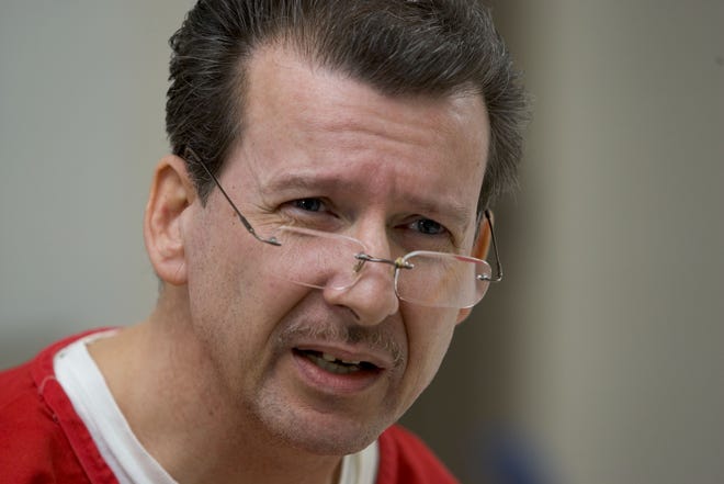 In this file image from March 3, 2005, William Michael Kopsho, who was convicted of first-degree murder and armed kidnapping for the death of his wife, Lynne, talks at the Marion County Jail about the events that led to his wife's murder. "I was an instrument in my wife's death but I'm not a murderer," he said. [Doug Engle/Star-Banner] 2005