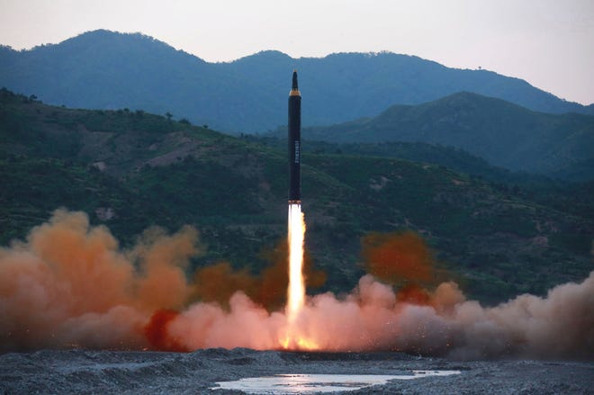 This May 14, 2017, photo distributed by the North Korean government shows the "Hwasong-12," a new type of ballistic missile at an undisclosed location in North Korea. North Korea on Monday, May 15, 2017, boasted of a successful weekend launch of a new type of "medium long-range" ballistic rocket that can carry a nuclear warhead. Outsiders also saw a significant technological jump, with the test-fire apparently flying higher and for a longer time period than any other such previous missile. Independent journalists were not given access to cover the event depicted in this photo. (