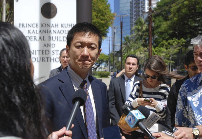 In this March 29, 2017, file photo, Hawaii Attorney General Douglas Chin speaks outside federal court in Honolulu, Hawaii. Three federal appellate court judges in Seattle on Monday, May 15, will hear the appeal of Hawaii's challenge to President Trump's travel ban targeting six predominantly Muslim countries. THE ASSOCIATED PRESS