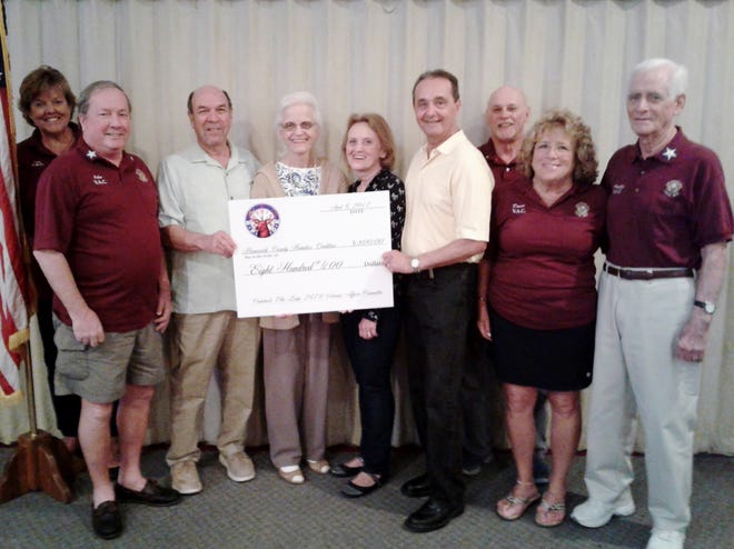 Making the presentation of an $800 check to the Brunswick County Homeless Coalition on behalf of the Veteranís Affairs Committee of Elks Lodge 2679 in Calabash were, from left, Janet Heinis, VAC Member; John Corbett, co-chair of the VAC; Jerry Rothenberg and Barbara Serafin, co-presidents of BCHC; Kathy Cyrulik, member of BCHC; David Cyrulik, BCHC treasurer; Gerald ìJerryî Kimble, co-chair of the VAC; Donna Kozlowski, VAC member; and Austin Sammon, chairman of the VAC. [CONTRIBUTED]