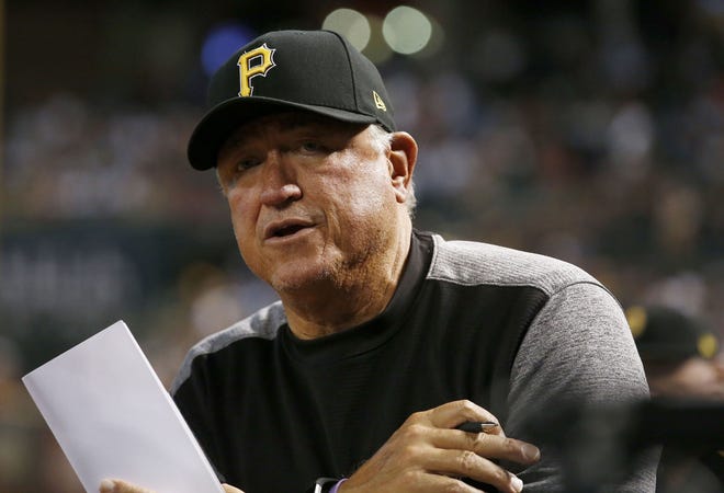 Pittsburgh Pirates' Clint Hurdle talks to an umpire as he makes a fielding switch during the eighth inning of a baseball game against the Arizona Diamondbacks on May 12 in Phoenix. The Diamondbacks defeated the Pirates 11-4.