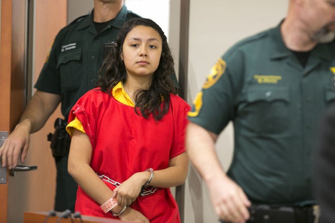 Yaquelin Galvez Don, then 13, enters a courtroom in this March 18, 2014, file photo. Authorities say she has skipped bail and they have a warrant for her arrest on charges of attempted first-degree murder with a deadly weapon and conspiracy to commit murder. [Alan Youngblood/Ocala Star-Banner]