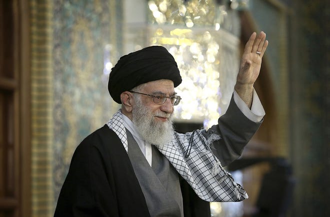 In this March 21, 2017 file photo, released by an official website of the office of the Iranian supreme leader, Supreme Leader Ayatollah Ali Khamenei waves to a crowd in a trip to the northeastern city of Mashhad, Iran. THE ASSOCIATED PRESS