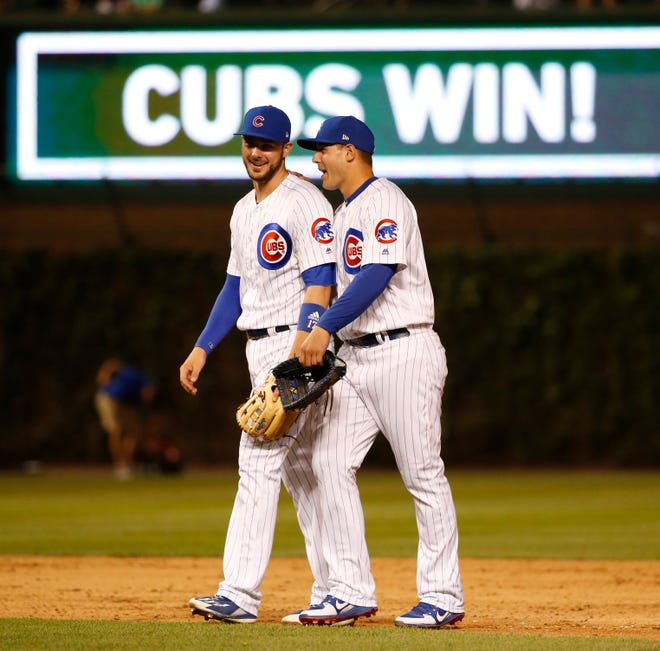 Chicago Cubs' Kris Bryant, left, and Anthony Rizzo celebrate the team's 7-5 win over the Cincinnati Reds in a baseball game Wednesday, May 17, 2017, in Chicago. (AP Photo/Charles Rex Arbogast)