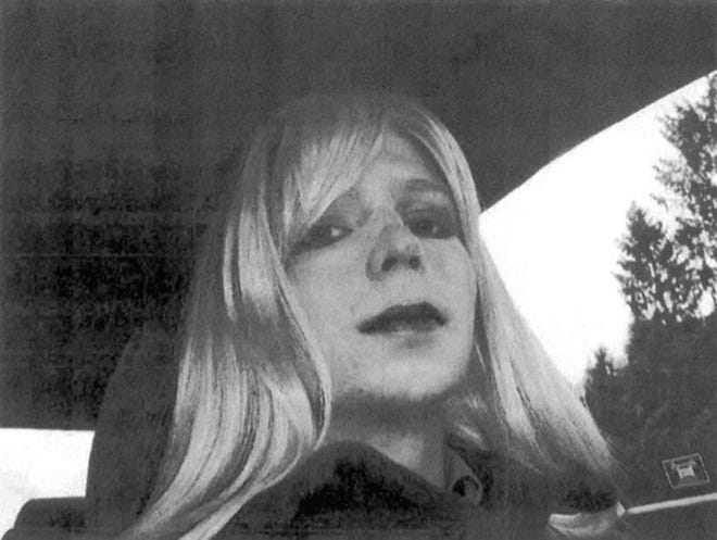 FILE - In this undated file photo provided by the U.S. Army, Pfc. Chelsea Manning poses for a photo wearing a wig and lipstick. Manning, the transgender soldier convicted in 2013 of illegally disclosing classified government information, will remain on active duty in a special status after her scheduled release from prison Wednesday, May 17, 2017. (U.S. Army via AP, File)