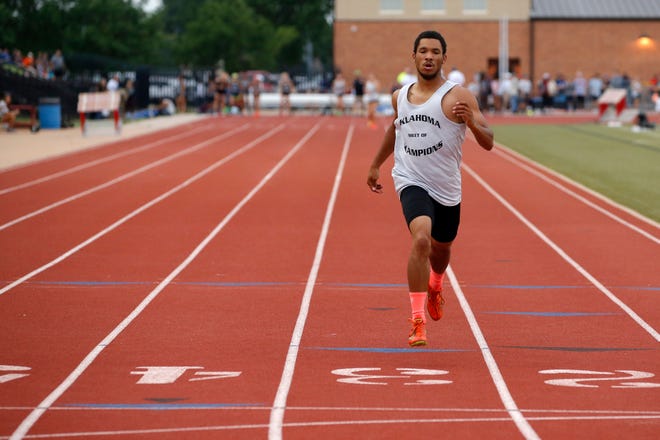 Daniel Burris of Broken Bow was the only runner to compete in the 400-meter dash Tuesday during the Meet of Champions at Moore Schools Stadium. Burris was awarded the gold, silver and bronze medals. [PHOTO BY BRYAN TERRY, THE OKLAHOMAN]