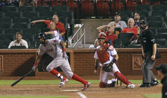Boston's Chris Young drives in the go-ahed run with a single in the 13th inning against the St. Louis Cardinals on Wednesday at Busch Stadium. The Red Sox won 5-4.