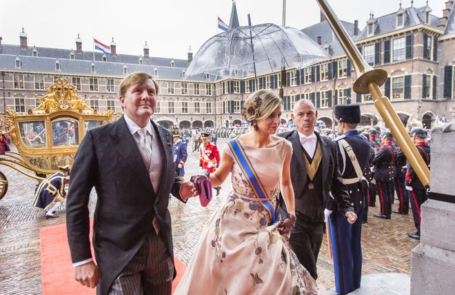 Netherlands' King Willem-Alexander, left, and his wife, Queen Maxima, arrive for the opening of the parliamentary year in 2015. [File Photo/The Associated Press]