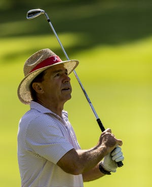 Alabama football coach Nick Saban hits a shot toward the second green at the PGA Champions Tour Regions Tradition Pro-Am golf tournament Wednesday at Greystone Golf & Country Club in Hoover. [The Associated Press]