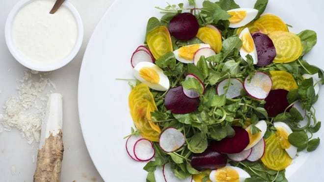 A watercress salad in New York, May 1, 2017. A simple salad pairs watercress with raw beets, radishes and eggs. This colorful rendition is easy to put together, employing raw beets, very thinly sliced and dressed only with salt, lemon juice and lemon zest. (Karsten Moran/The New York Times)