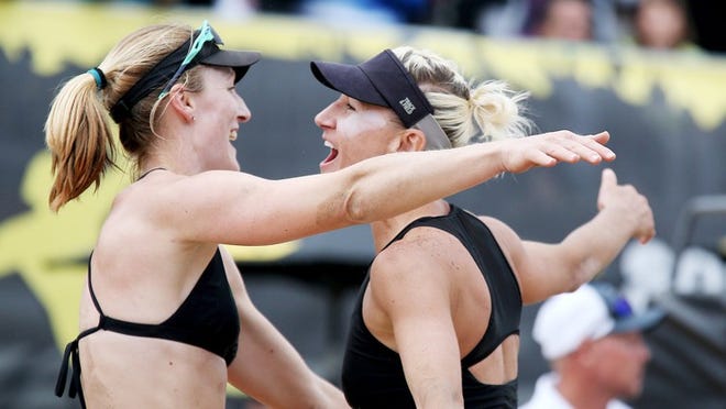 Emily Day, left, and Brittany Hochevar celebrate their victory over Betsi Flint and Kelley Larsen during the AVP Huntington Beach Open women’s finals on Sunday, May 7, 2017 in Huntington Beach, Calif. (Luis Sinco/Los Angeles Times/TNS)