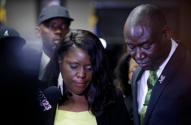 Tiffany Crutcher, sister of Terence Crutcher, speaks with attorney Benjamin Crump after Tulsa Police officer Betty Jo Shelby was found not guilty of manslaughter in the Sept. 2016 fatal shooting of Terence Crutcher, Wednesday, May 17, 2017. Crutcher, says that her brother did not show any aggression toward Shelby, did not attack her and did not threaten the officer. (Mike Simons/Tulsa World via AP)