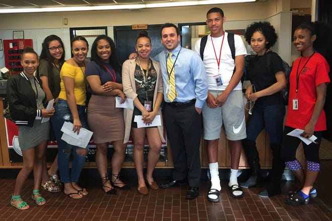 East Middle School teacher Jason Gonzalez (center) with his first-ever class of students, who wrote themselves letters in seventh grade and opened them as seniors on May 18, 2017.