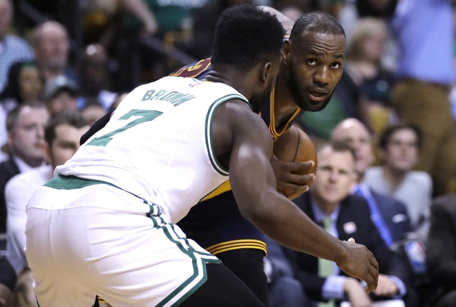 Cleveland Cavaliers forward LeBron James, right, scored 38 points during Wednesday's Game 1 of the Eastern Conference Finals in Boston. The Cavs won 117-104. [AP Photo/Charles Krupa]