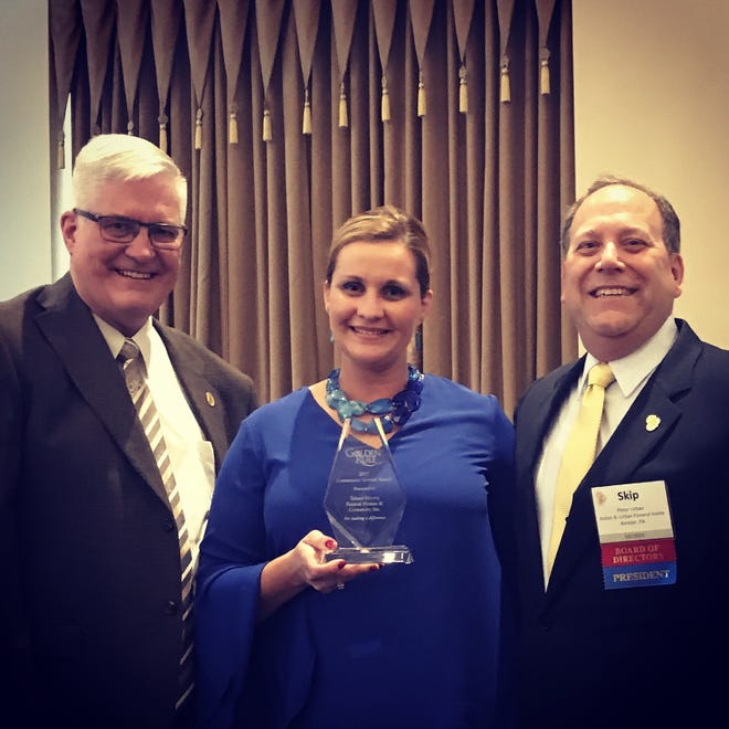 SUMBITTED PHOTO

n John Herzig (left) and Tricia Herzig-McKinnon of Toland-Herzig Funeral Home & Crematory recently received the 2017 Golden Rule Community Service Award from Peter "Skip" Urban, immediate past president of International Order of the Golden Rule.
