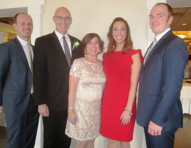 Irene and John Kucinski take time for a family picture with their children, from left, Ryan, Maria and Christopher before Irene is honored as Citizen of the Year. [WICKED LOCAL PHOTO/MYRNA FEARER]