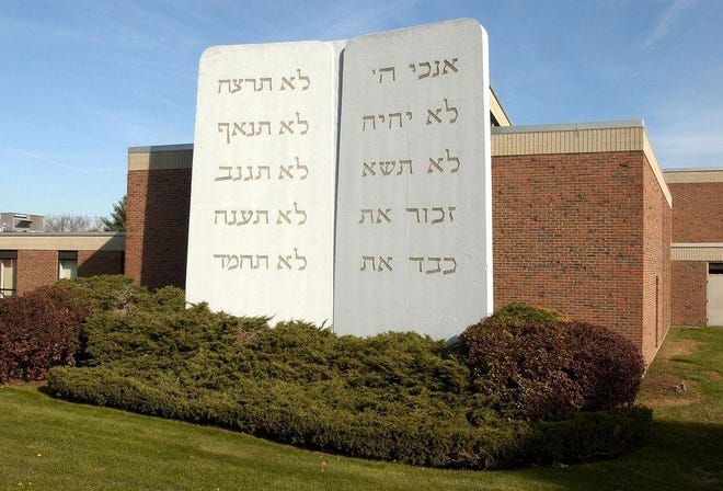 Temple Beth Am congregants will move out of their building of six decades on Sunday afternoon and head to Temple Beth Abraham in Canton. 

[File photo]