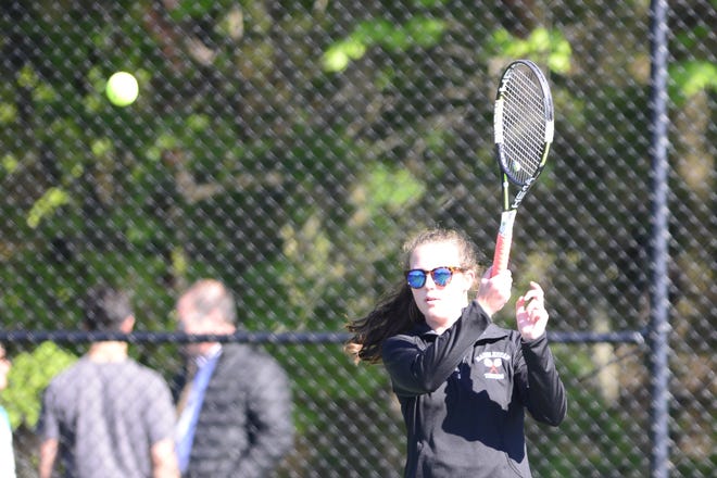 Marblehead girls' tennis co-captain Julia Channing returns a serve during a recent third singles match. Channing has helped engineer her teammates to an unbeaten conference record after 16 matches. [Courtesy photo / Luann Gabel]