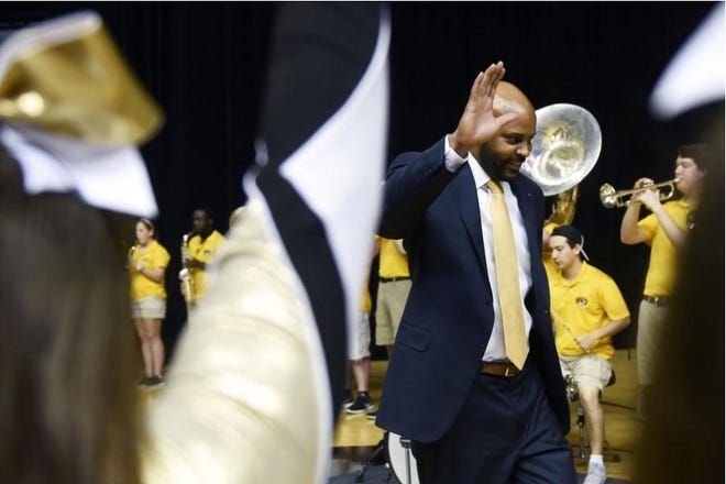 Cuonzo Martin walks onto the court during the campus celebration event to welcome him as the new men's basketball coach on March 20.