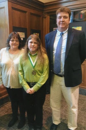 In the picture from left – Kathleen Pendergrast, Shannon Pendergrast, and Mr. Joseph W. Farrell, high school principal.