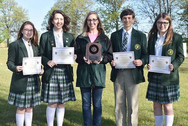 Students from Will Carleton Academy recently took first place in the small school division during the second annual Moore Math Marathon at Albion College. Pictured includes, (left-right) Ashlynn Smith, Clare Falater, coach Sandra Anderson, Brendan Busch and Lacy Saunders. [COURTESY PHOTO]