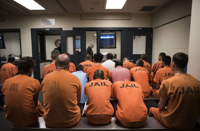 Jail inmates await their first appearance before a judge. [Nick Adams/GateHouse Media Services]