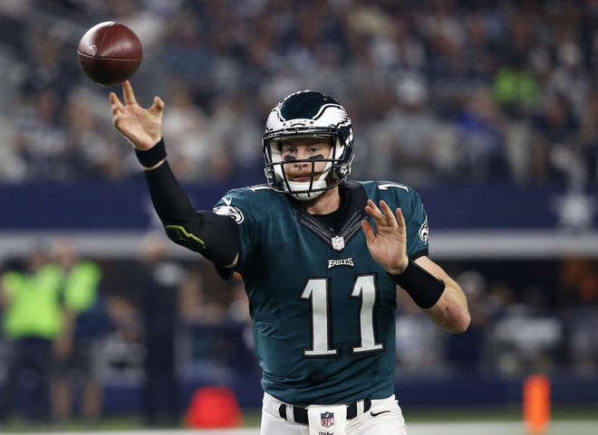 (File) All eyes will be on quarterback Carson Wentz when the Eagles open OTAs on Tuesday.