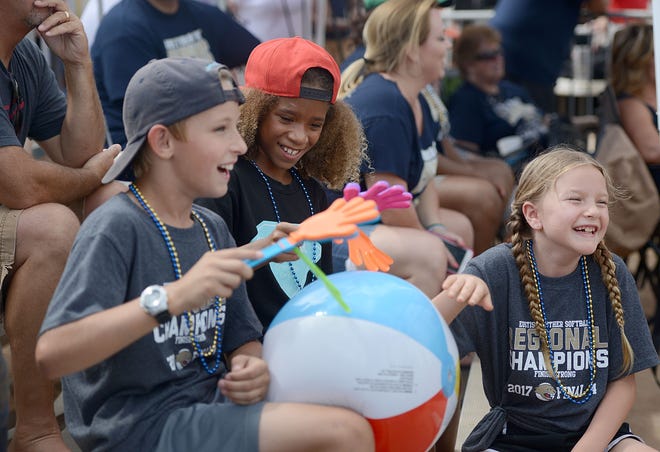 Young fans cheer on the Eustis Panthers during a Class 5A state semifinal softball game on Friday in Vero Beach. [AMBER RICCINTO / DAILY COMMERCIAL]