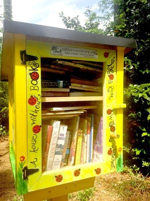 Cover for Sat Extra 052017 The Little Library at the Cape Fear Botanical Garden is operated by a gruop of elementary school girls from The Fayetteville Academy. [Contributed photo]