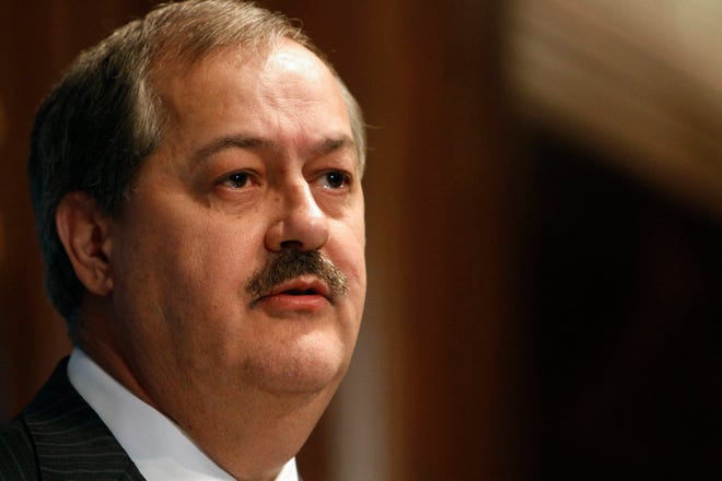 FILE - In this July 22, 2010, file photo, former Massey Energy CEO Don Blankenship speaks at the National Press Club in Washington. Blankenship recently finished a year in prison for conspiracy to violate federal mine safety standards at Upper Big Branch, where 29 miners were killed in an explosion in 2010. Massey told The Associated Press on Friday, May 19, 2017, that he will keep up his fight for vindication and to try to convince people that natural gas, and not methane gas and excess coal dust, was the root of the explosion. (AP Photo/Jacquelyn Martin, File)