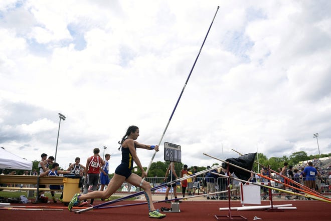Columbia Independent School's Khristen Bryant heads down the runway in the pole vault Saturday at the state track meet at Adkins Stadium in Jefferson City. Bryant set the all-class state record with a vault of 13 feet. [SARAH BELL PHOTOS/TRIBUNE]
