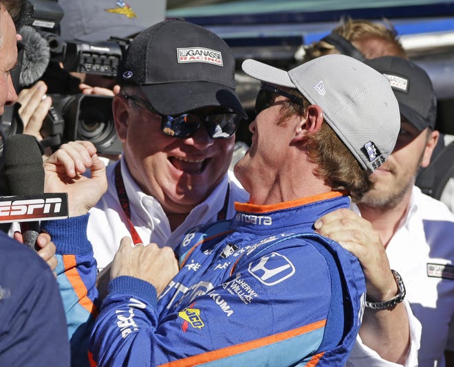 Scott Dixon, right, of New Zealand, celebrates with car owner Chip Ganassi after winning the pole during qualifications for the Indianapolis 500 IndyCar auto race at Indianapolis Motor Speedway, Sunday, May 21, 2017, in Indianapolis. (AP Photo/Michael Conroy)