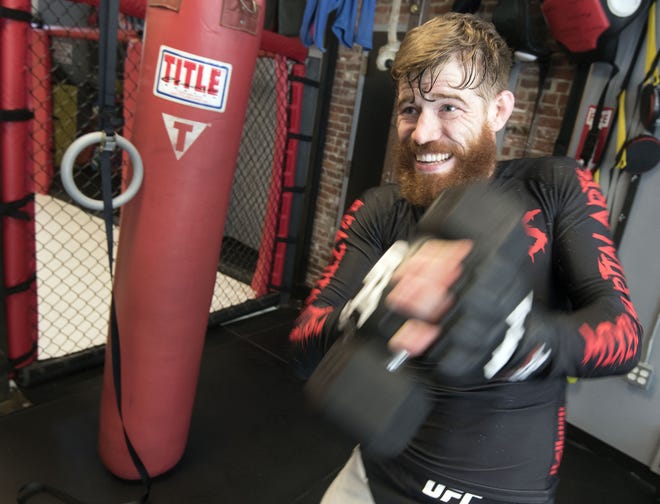 Devin Powell trains at Nostos Mixed Martial Arts in Somersworth for his upcoming Ultimate Fighting Championship match scheduled for June 25 in Oklahoma City. [John Huff/Fosters.com]