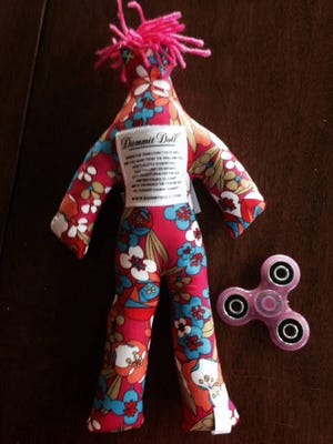 A 'dammit doll' and fidget spinner may help take the edge off.