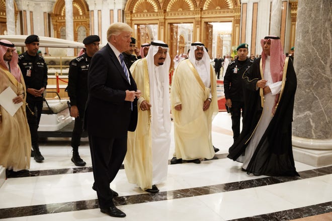 President Donald Trump and Saudi King Salman, center left, arrive Sunday at the Arab Islamic American Summit, at the King Abdulaziz Conference Center in Riyadh, Saudi Arabia. [AP Photo/Evan Vucci]