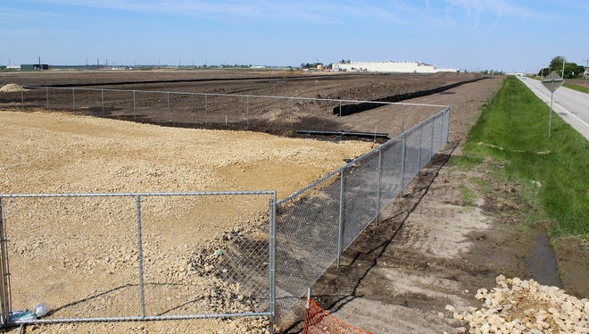 A new Kraft Heinz plant, seen in the distance, is under construction at the Eastern Iowa Industrial Center and will be a neighbor to Sterilite. [Photo/Nicholas Schmidt]