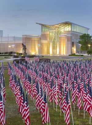 Hundreds of U.S. flags make up the annual Field of Honor outside the Airborne & Special Operations Museum each year. [Johnny Horne/The Fayetteville Observer]