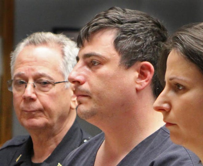 Allen J. Hanson, middle, is arraigned in District Court, Providence, Monday morning in the death of his girlfriend, Jennifer Silva.