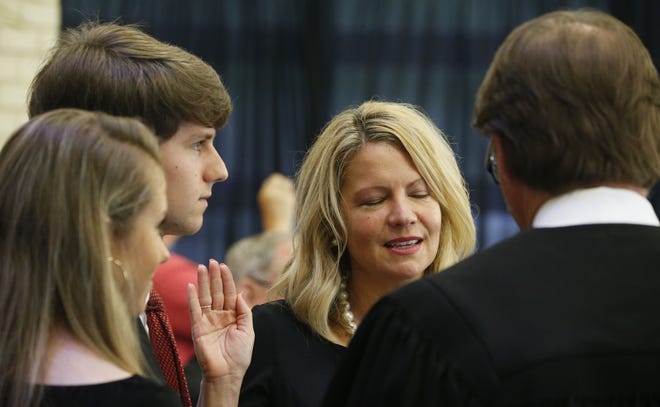 Cynthia Almond is sworn in Monday as the District 3 representative on the Tuscaloosa City Council. The inauguration ceremony for council members and the Tuscaloosa City Board of Education was held at the Tuscaloosa River Market. [Staff Photo/Gary Cosby Jr]