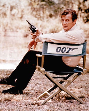 FILE - British actor Roger Moore, playing the title role of secret service agent 007, James Bond, is shown on location in England in 1972. Moore, played Bond in seven films, more than any other actor. Roger Moore's family said Tuesday May 23, 2017 that the former James Bond star has died after a short battle with cancer (AP Photo, File)