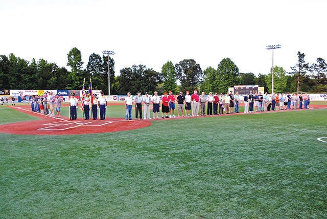 A REAL HIT — Veterans are honored at the Asheboro Copperheads Baseball game at McCrary Ball Park in June 2015 as the Randolph Honor Guard presents the colors. Veterans Appreciation Night will take place this year on June 3. (Ricky Ingold/ The Courier-Tribune)