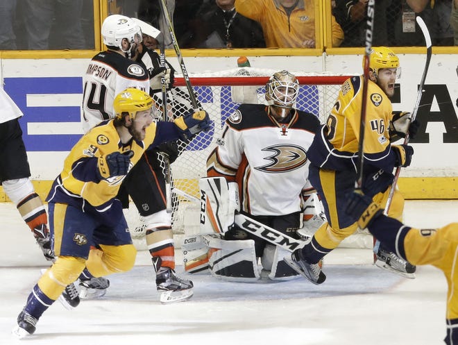 Anaheim Ducks goalie Jonathan Bernier kneels on the ice as Nashville Predators' Filip Forsberg (9) and Pontus Aberg (46) celebrate a goal by teammate Colton Sissons during the third period in Game 6 of the Western Conference final in the Stanley Cup playoffs Monday in Nashville, Tenn. Sissons had a hat trick as the Predators won 6-3 to win the series 4-2 and advance to the Stanley Cup Finals. [AP Photo / Mark Humphrey]