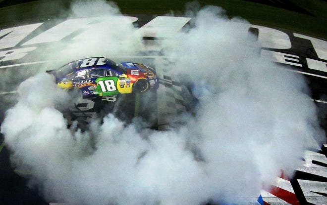 Kyle Busch creates a ring of tire smoke after winning Saturday night's All Star Race at Charlotte. [NASCAR GETTY IMAGES/SARAH CRABILL]